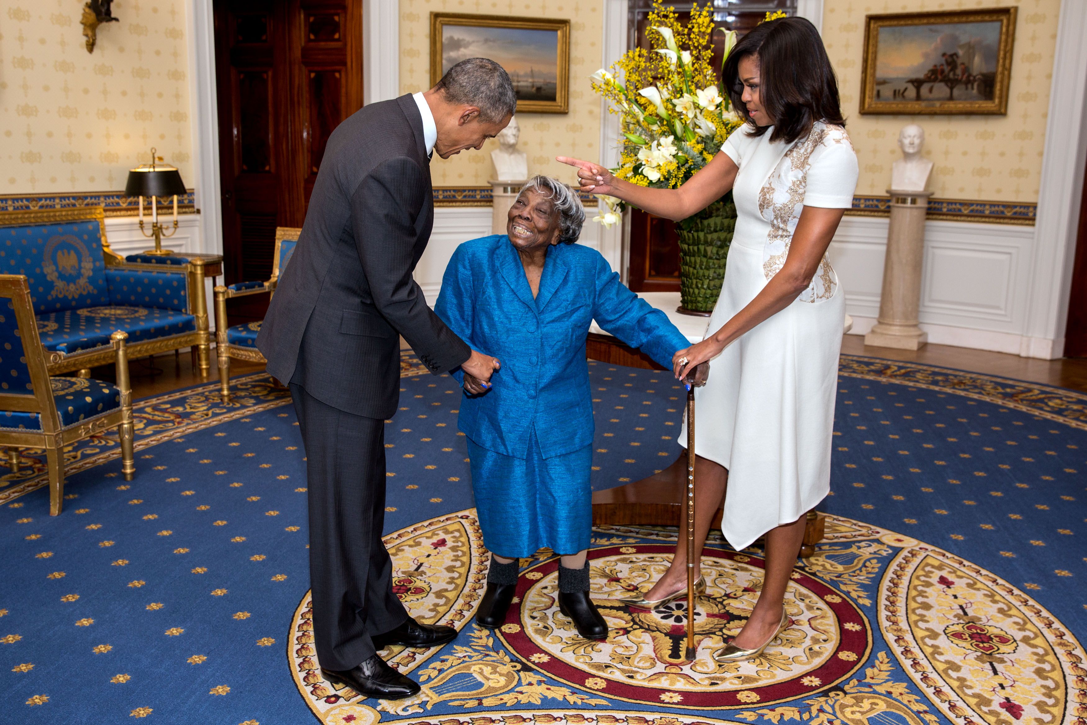 President Barack Obama and First Lady Michelle Obama greet 106 Year Old Virginia McLaurin during a photo line in the Blue Room of the White House prior to a reception celebrating African American History Month Feb. 18 2016